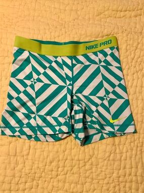 Nike Pro Geometric Performance biker Shorts in Teal & Neon Yellow